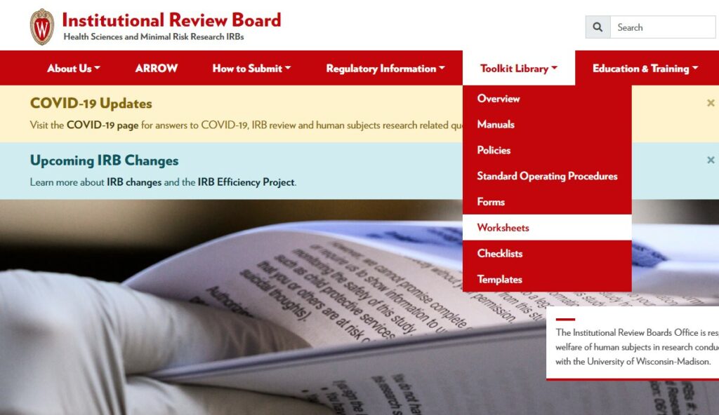 Screenshot of the IRB's website at irb.wisc.edu, showing the "Toolkit Library" drop-down menu that comes from the red navigation bar at the top. Within this drop-down menu, "Worksheets" is selected.